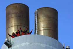 greenpeace at the top of the stacks